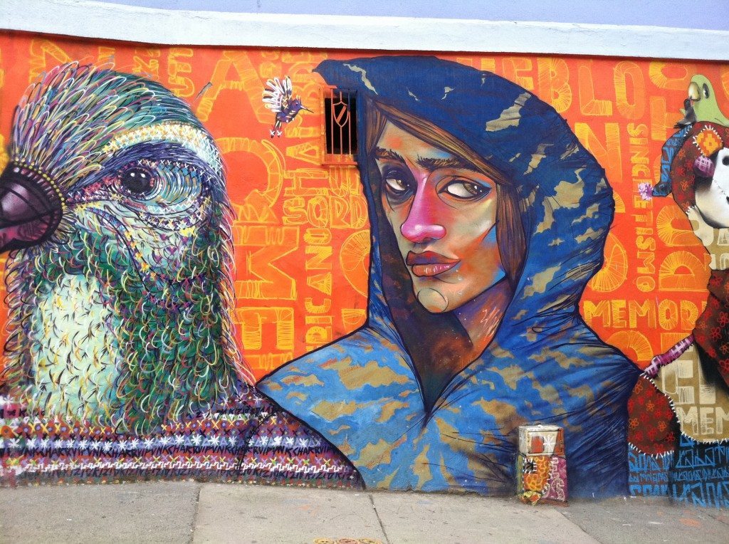 Valparaiso street art of lady next to bird